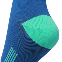Knee high socks in blue with a green heel and toe section, featuring a logo.