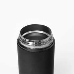 A drink bottle with a sleek black exterior and a silver rim around the opening. It features a logo on the side.