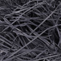 A pile of thin, dark grey paper strands, creating a textured, shredded appearance in a close-up view.