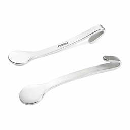 A set of two silver metal spoons with a sleek, curved design, featuring a logo on one of the handles.
