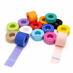 A variety of decorative tape rolls in multiple colours including blue, pink, yellow, and green, arranged in an artistic layout.