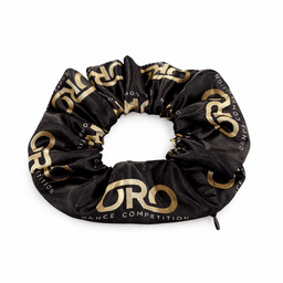 A black scrunchie featuring a gold logo and design for a dance competition, made from a soft fabric.
