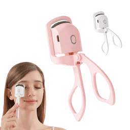 A pink eyelash curler is shown being used by a person, accompanied by a smaller white version.