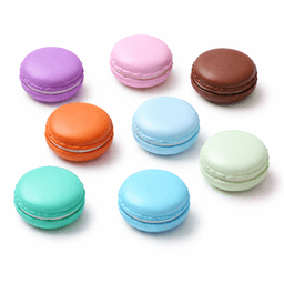 A variety of macarons in purple, pink, brown, orange, green, blue, and aqua colours arranged in a circle.