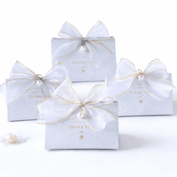 Four grey gift boxes adorned with white bows and gold ribbon, featuring pearl embellishments and "Thank You" text.