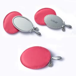 A pink mini cosmetic mirror with a sleek silver finish and a decorative pull tab. Includes a logo on the mirror.