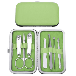 A green manicure set in a metal case, featuring scissors, clippers, a cuticle pusher, and other grooming tools.