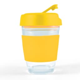 A reusable coffee cup with a clear glass body, yellow silicone sleeve, and yellow flip lid. It features a logo.