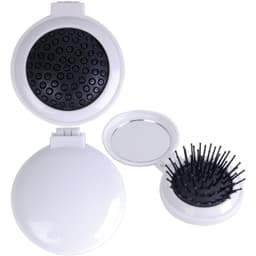 A compact pop-up brush and mirror set in white, featuring a brush with black bristles and a round mirror.