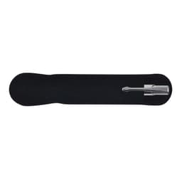 A silver metal pen rests on a black velvet holder, showcasing its sleek design.
