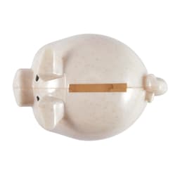 A small, eco-friendly pig-shaped coin bank with a light speckled finish and a slot for coins.