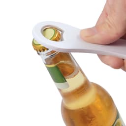 A drink bottle opener designed for easy cap removal, featuring a white plastic handle and a contoured opening.