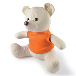 A plush bear in a light cream color with a brown nose, wearing an orange shirt. It has a friendly expression and is seated.