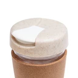A reusable coffee cup with a cork band and a light-colored lid featuring a sliding opening.