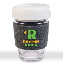 A reusable coffee cup featuring a clear body, white flip lid, and a grey RPET band. It has a logo on the band.