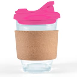 A reusable coffee cup features a clear glass body, a pink snap lid, and a cork band for grip and insulation.
