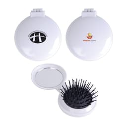 A white compact mirror and brush set featuring a textured brush head and a reflective surface, with logos on the exterior.