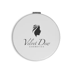 A round white compact mirror featuring a logo and an elegant design of a woman's profile.