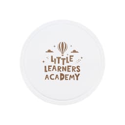 A round white promotional item featuring the text "Little Learners Academy" in brown with a hot air balloon and stars.