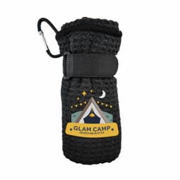 A black travel towel with a textured appearance, secured by a strap and featuring a logo or branding.