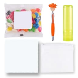 An assortment of colorful jelly beans, an orange and silver pen, a lime green lip balm, a white cloth, and a clear pouch.