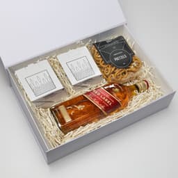 A gift box containing a bottle of whisky, pretzels, and two takeout-style containers. Predominantly brown and white.