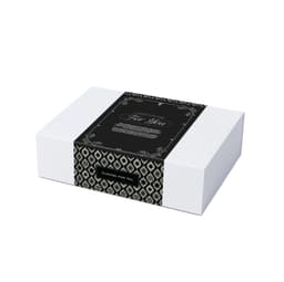 A gift box featuring a black and white patterned design, wrapped with a decorative band.