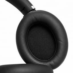 Black over-ear headphone cushion with a soft finish and a sleek design. Features a logo on the ear cup.