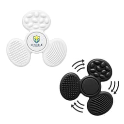 A tactile fidget spinner in white and black, featuring various textured surfaces and a central logo.