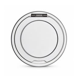 A round, silver magnetic charger with a stand, featuring a smooth surface and a hinged element.