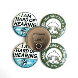 A drink bottle opener magnet in silver with a logo, surrounded by three circular printed magnets in blue and green.