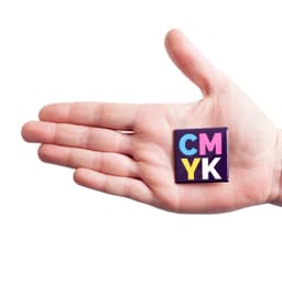 A hand holds a square badge featuring vibrant colours, including purple, pink, and yellow, with a logo.