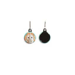 A custom printed 32mm round zipper pull featuring a dog design, with a black back and a hanging clip.