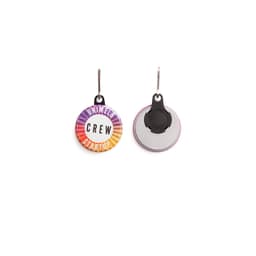 A round zipper pull in vibrant colours featuring a logo on one side and a smooth back.