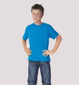 A blue junior T-shirt worn by a child, standing with hands on hips, against a plain background.