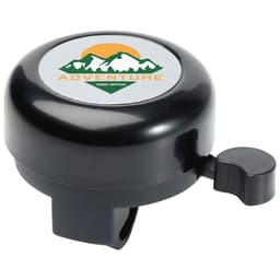 A black bicycle bell with a circular top featuring a logo and a lever on the side for ringing.