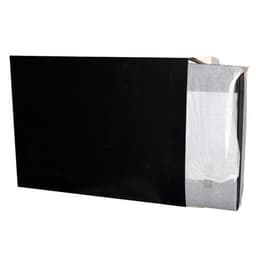 A black zipped compendium featuring a calculator, partially opened to reveal contents. It has a logo on the exterior.