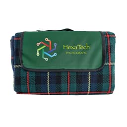 A folded picnic rug featuring a green and tartan check pattern, with a logo on the front.