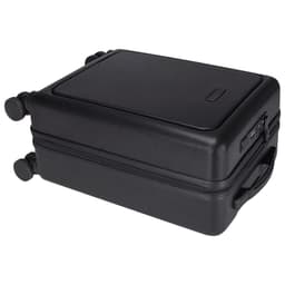 A black wheeled cabin trolley with a hard exterior, featuring a handle and two wheels for easy transport.