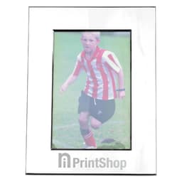 A nickel-plated photo frame with a glossy finish, displaying a photo of a child in a striped jersey.