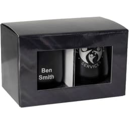 A gift box containing two black drinkware items, featuring one with a logo and another with personalised text.