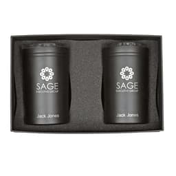 A gift box containing two black tumblers with a logo, placed in a protective foam insert.