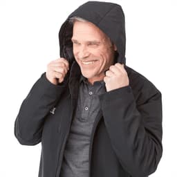 A man wearing a black Bryce Insulated Softshell Jacket with a hood, smiling and adjusting the jacket.