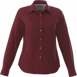 A burgundy long sleeve women's button-up shirt with a classic collar and buttons down the front. Features branding.