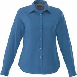 A women's Wilshire long sleeve button-up shirt in a vibrant blue colour with a classic collar and a logo.