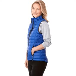 A women's vest in bright blue, featuring a zip front and a high collar, with a logo on the chest.