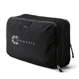 A black packing cube with a mesh side, featuring a logo. Designed for efficient organisation of belongings.