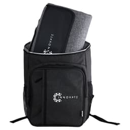 A black backpack with a large compartment containing a grey picnic blanket and an emblem on the front.