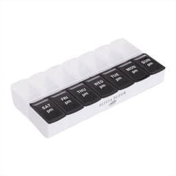 A white and black AM/PM pill case with compartments for each day of the week. Features a logo on the base.