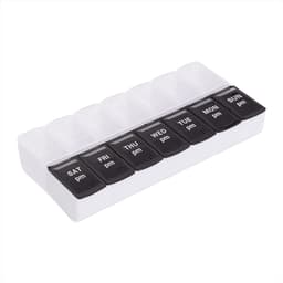 A white and black recycled AM/PM pill case with compartments labelled for each day of the week.